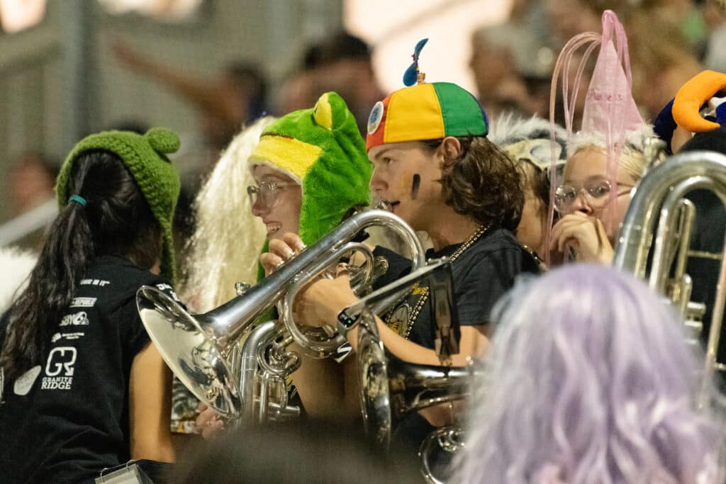 band members playing music during a football game